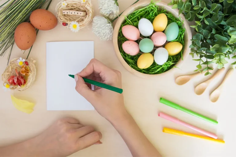 Woman practicing drawing using drawing prompts and holding pen with eggs nearby for easter